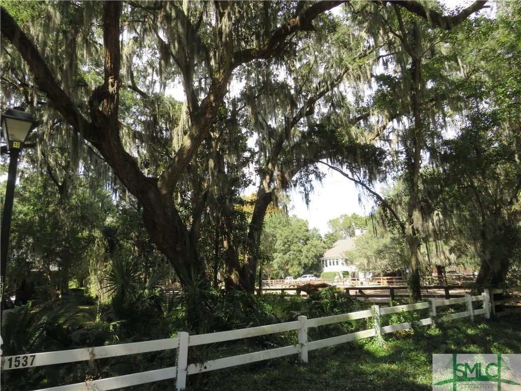 1537 Walthour Road Savannah, GA 31410 - Photo 38 of 40 Rail fence across front of property -- neighbors