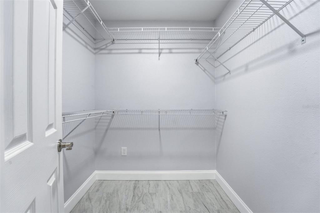 808 Guild Drive Venice, FL 34285 - Photo 16 of 27 a view of a room with racks on the wall