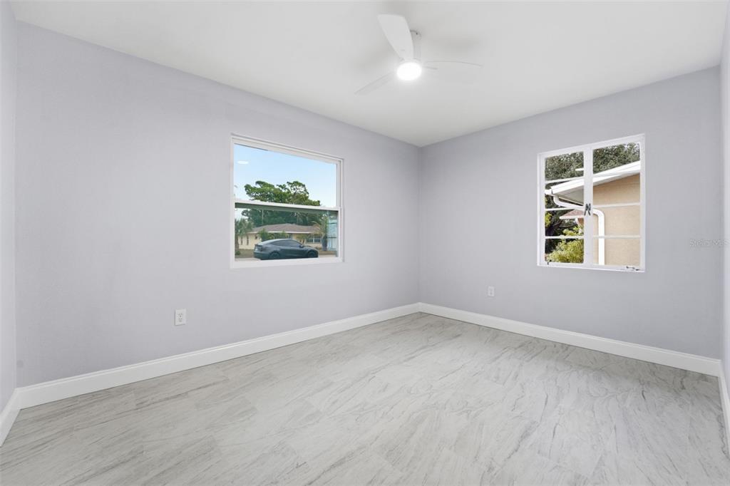 808 Guild Drive Venice, FL 34285 - Photo 10 of 27 an empty room with windows
