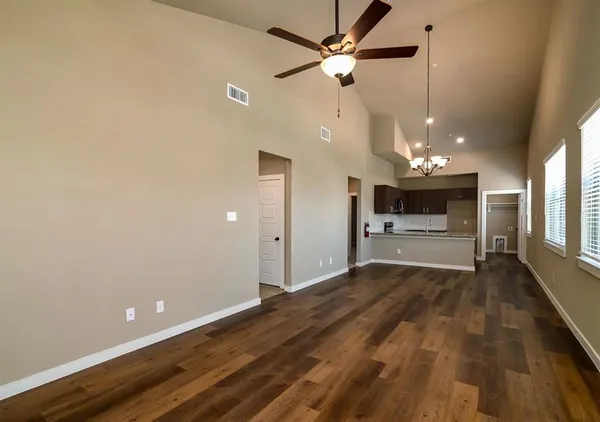 a kitchen with a sink and microwave