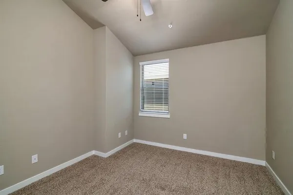 a view of a hallway with a window