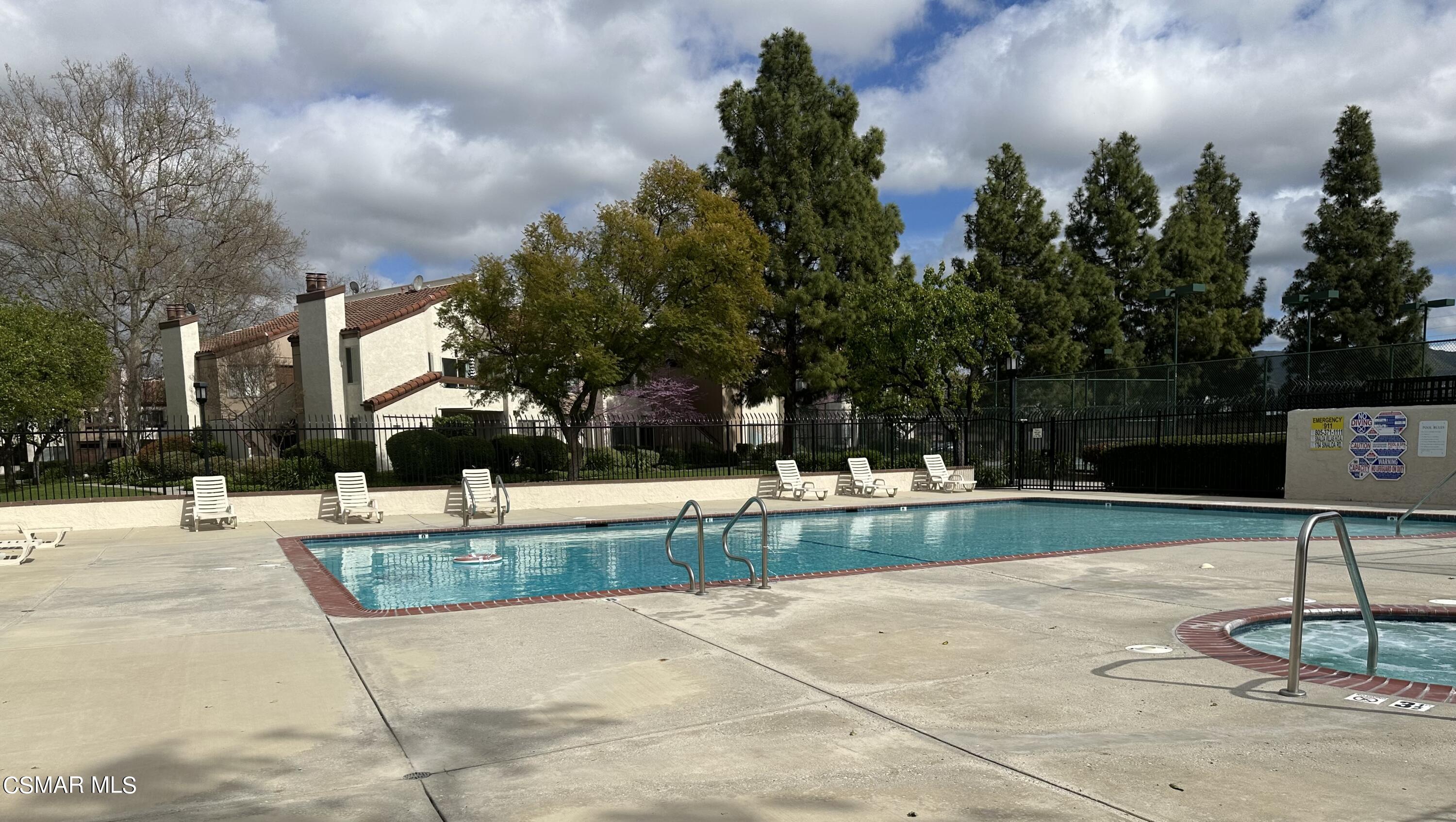 1760 Sinaloa Road, Unit 167 Simi Valley, CA 93065 - Photo 5 of 8 a view of a swimming pool with a patio
