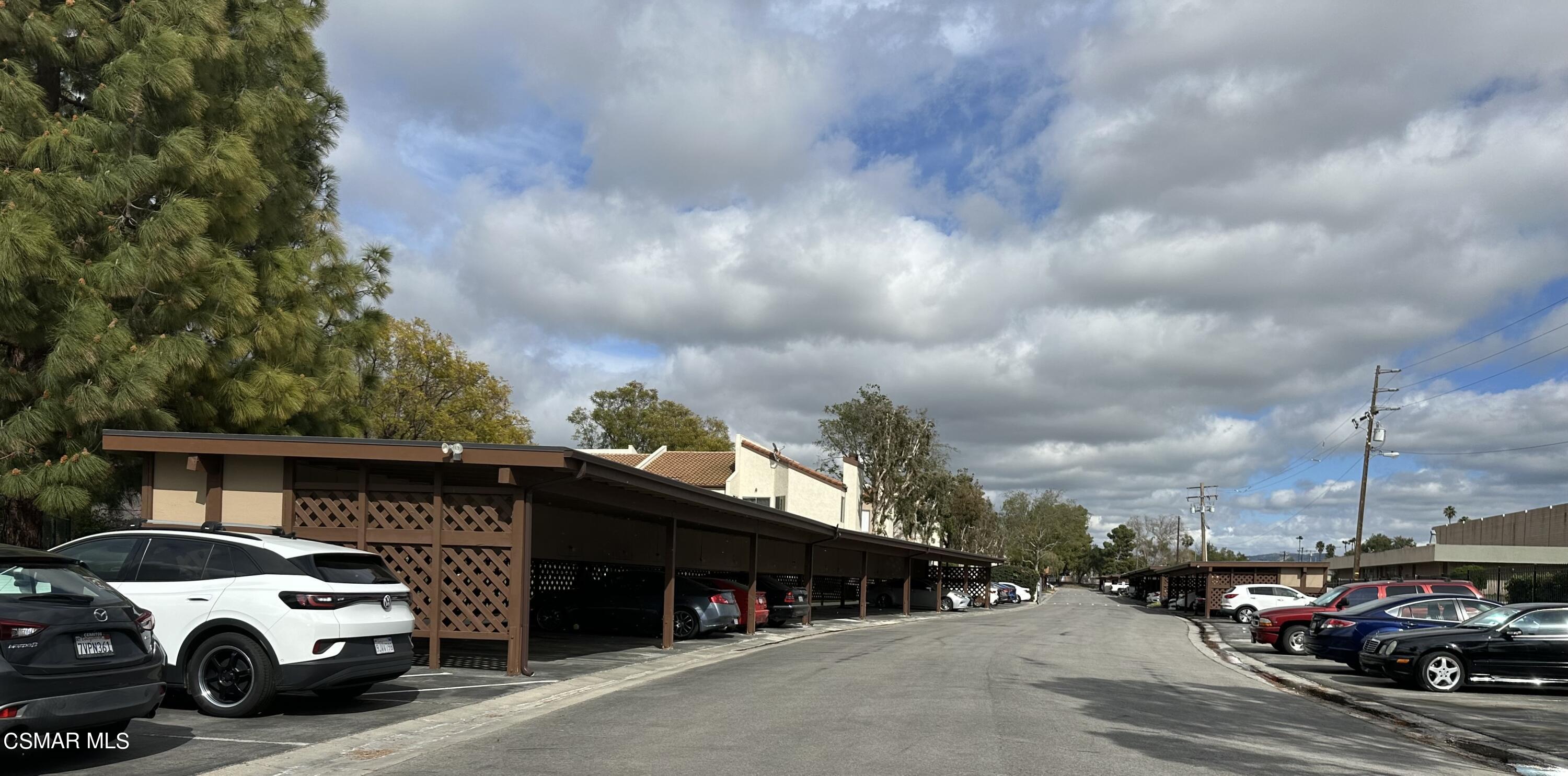1760 Sinaloa Road, Unit 167 Simi Valley, CA 93065 - Photo 7 of 8 a car parked in front of a building
