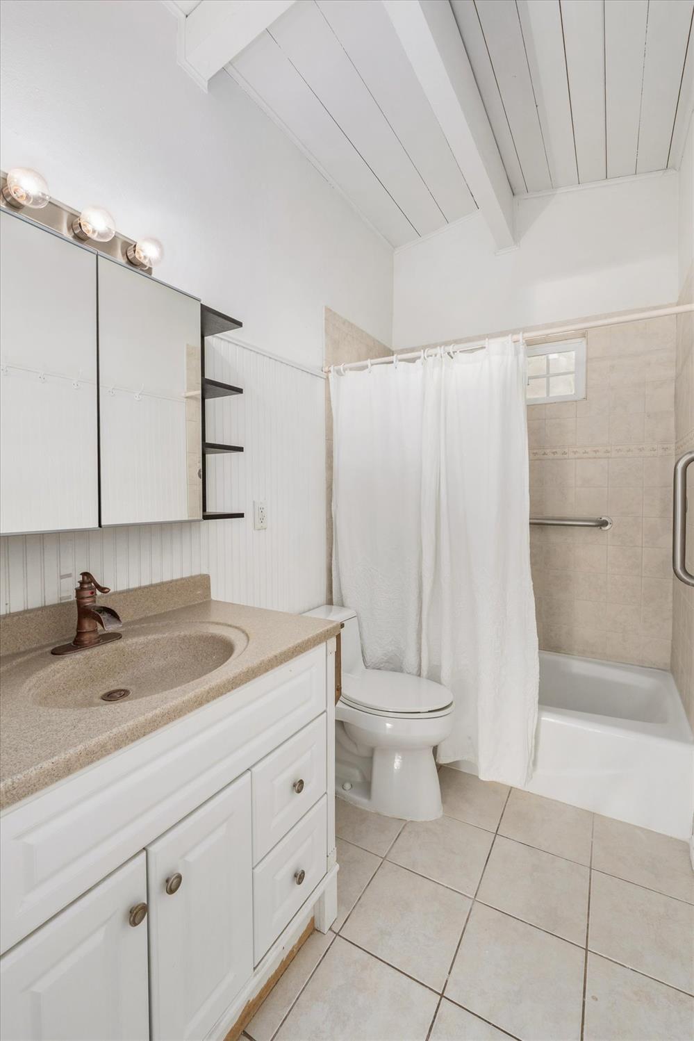 8653 Hidden Valley Road Mountain Ranch, CA 95246 - Photo 25 of 41 a bathroom with a sink a toilet and shower