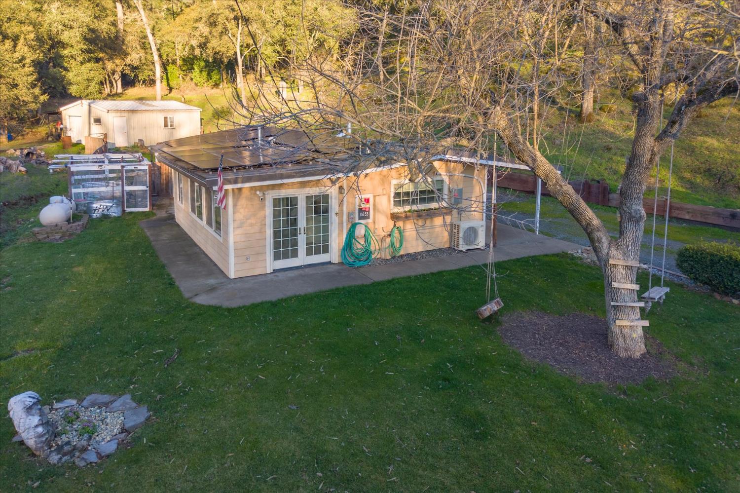 8653 Hidden Valley Road Mountain Ranch, CA 95246 - Photo 28 of 41 a view of a house with a yard