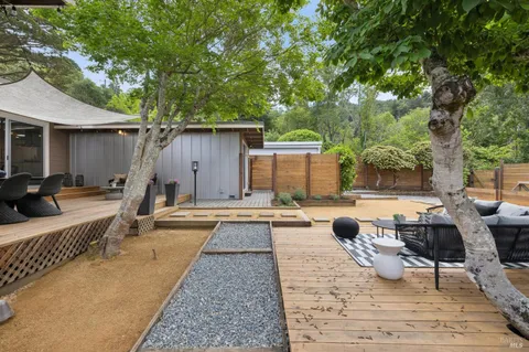 a view of a patio with swimming pool table and chairs