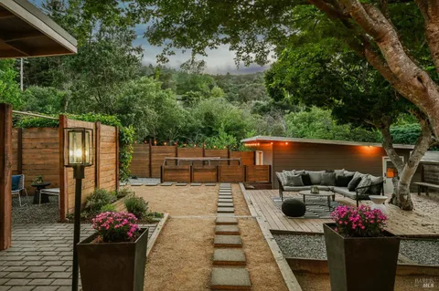 a view of outdoor sitting area with furniture