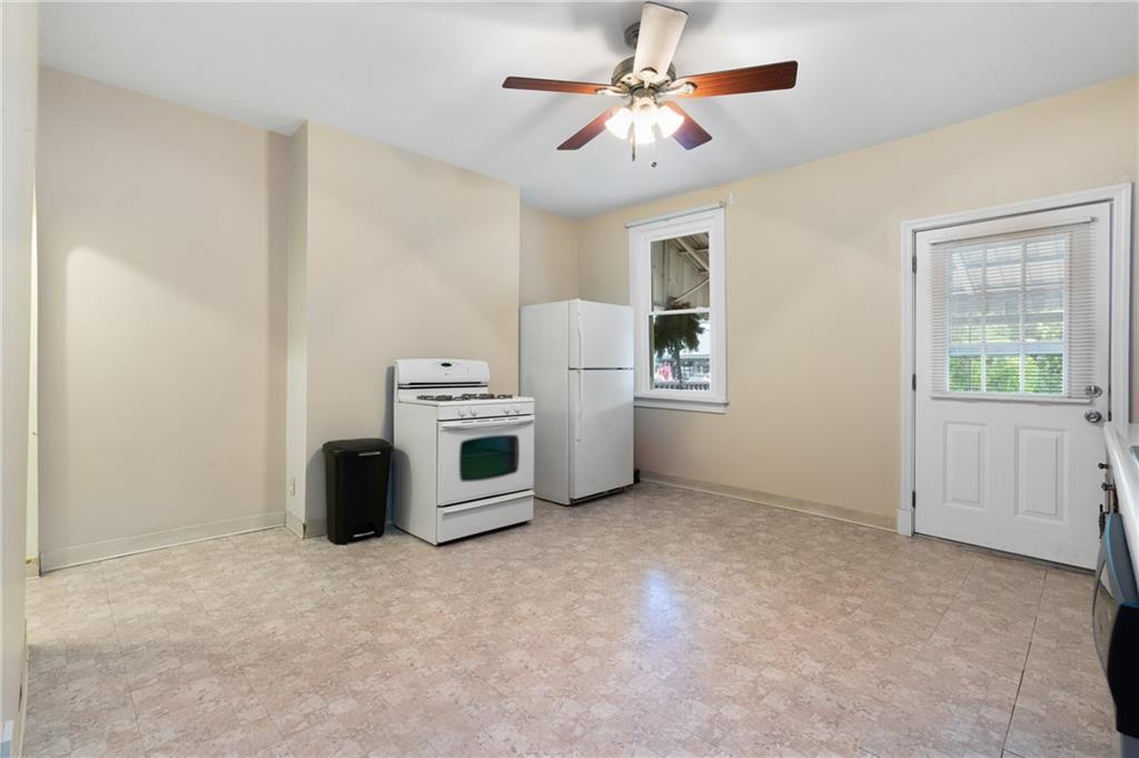 316 Stanton Pittsburgh, PA 15209 - Photo 15 of 32 a view of a livingroom with furniture and a ceiling fan