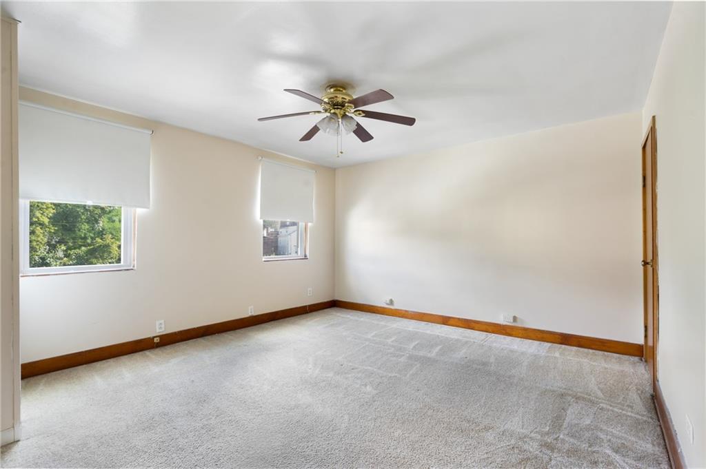 316 Stanton Pittsburgh, PA 15209 - Photo 17 of 32 an empty room with windows and fan