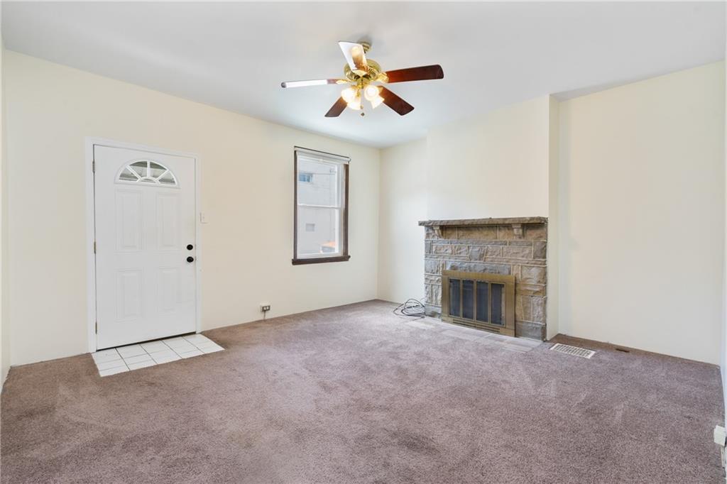 316 Stanton Pittsburgh, PA 15209 - Photo 5 of 32 an empty room with fan and windows