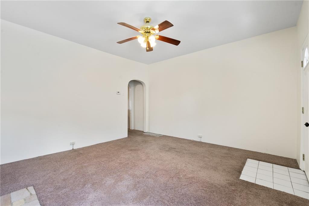 316 Stanton Pittsburgh, PA 15209 - Photo 7 of 32 an empty room with closet and a ceiling fan