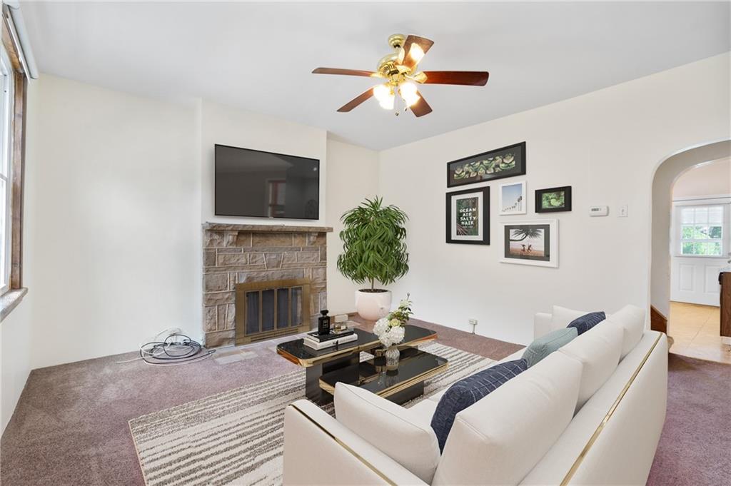 316 Stanton Pittsburgh, PA 15209 - Photo 8 of 32 a living room with furniture and a fireplace