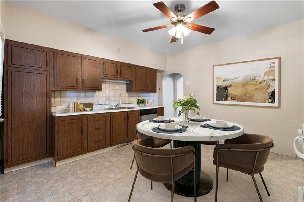 316 Stanton Pittsburgh, PA 15209 - Photo 10 of 32 a kitchen with a dining table and chairs