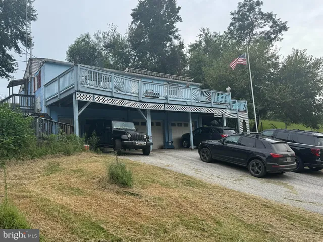 a view of a car park in front of house