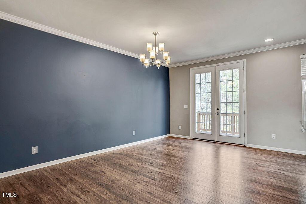 529 Metro Station Apex, NC 27502 - Photo 15 of 28 a view of an empty room with wooden floor and a window