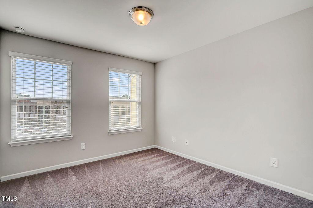 529 Metro Station Apex, NC 27502 - Photo 16 of 28 an empty room with a window