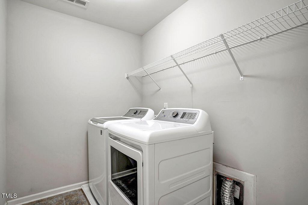 529 Metro Station Apex, NC 27502 - Photo 18 of 28 a utility room with dryer and washer
