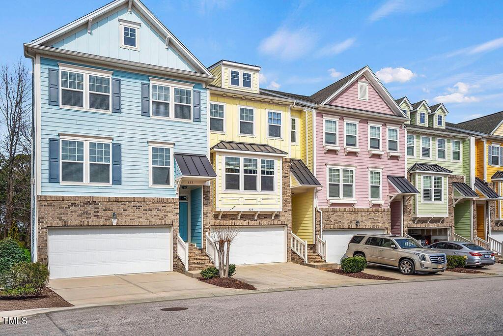 529 Metro Station Apex, NC 27502 - Photo 2 of 28 a front view of a residential apartment building with a yard