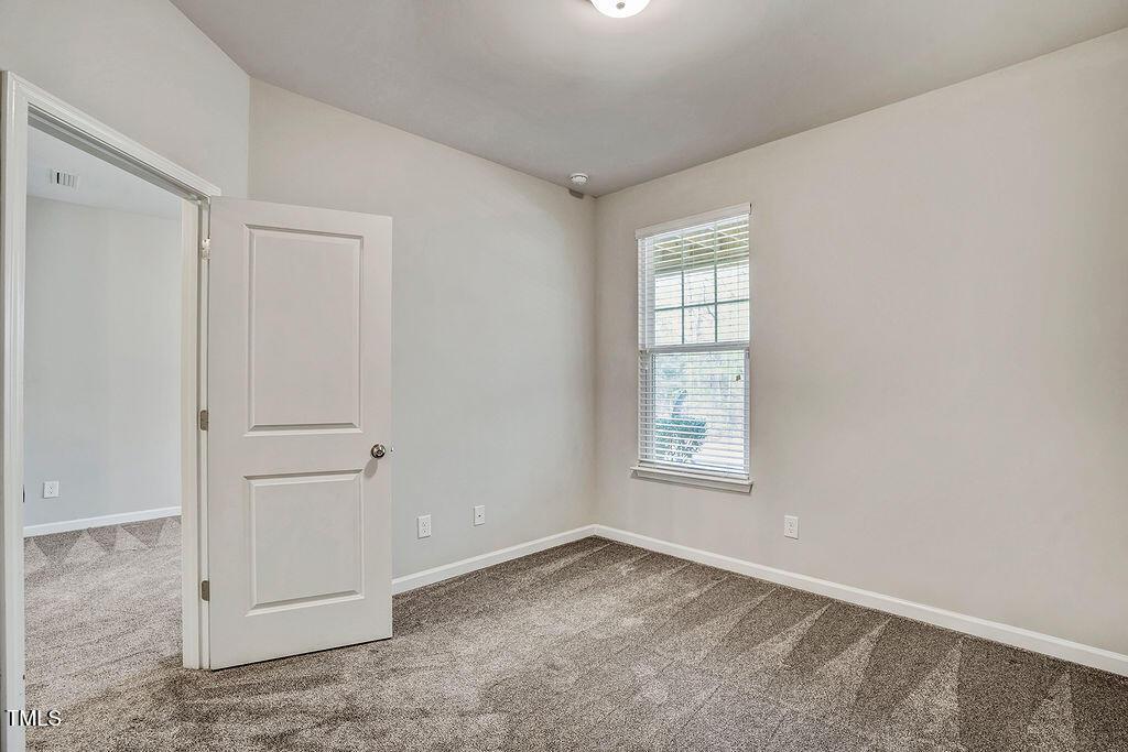 529 Metro Station Apex, NC 27502 - Photo 24 of 28 an empty room with windows and closet