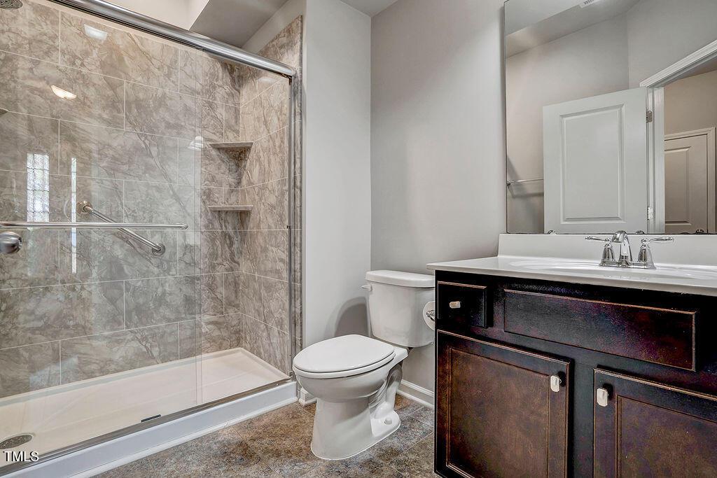 529 Metro Station Apex, NC 27502 - Photo 26 of 28 a bathroom with a sink toilet and shower