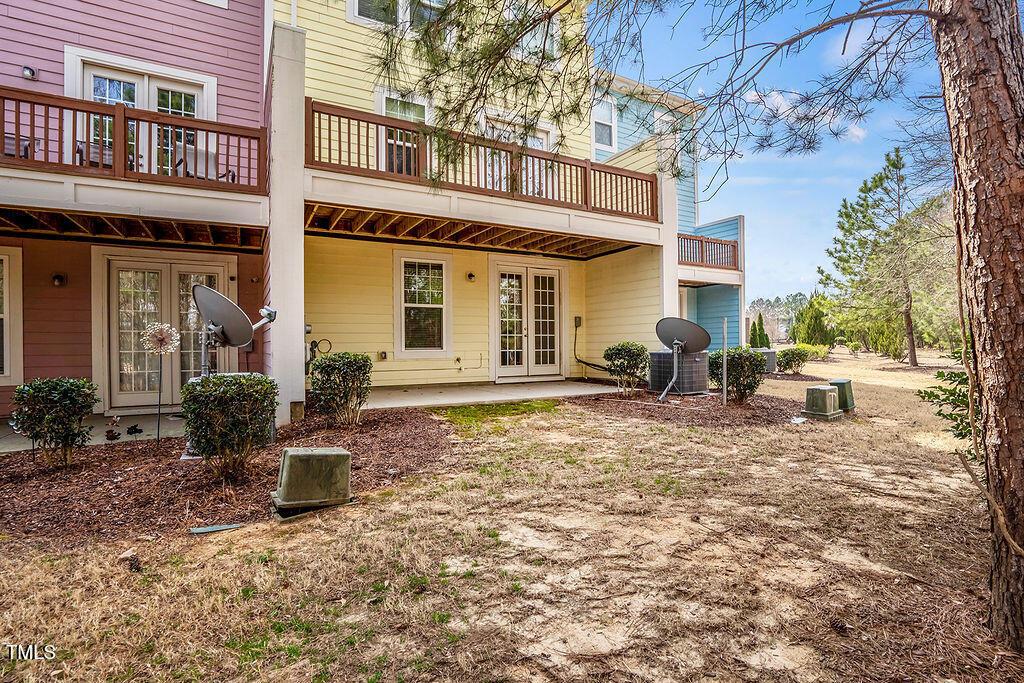 529 Metro Station Apex, NC 27502 - Photo 6 of 28 a backyard of a house with yard and outdoor seating