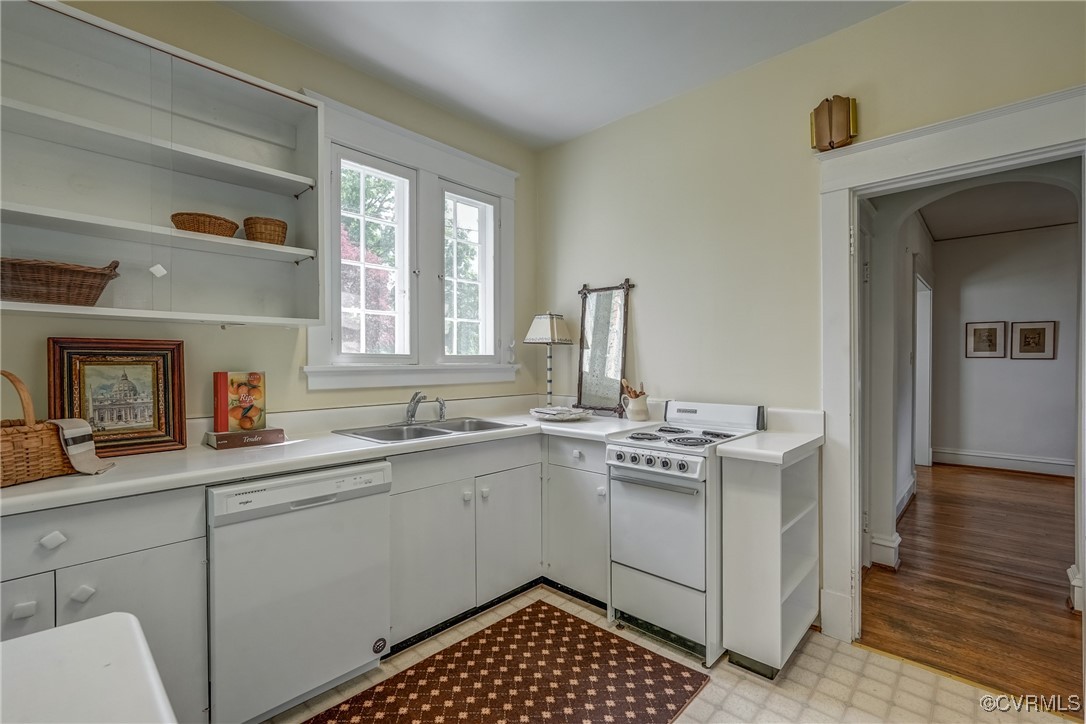 4101 Crestwood Road Richmond, VA 23227 - Photo 19 of 48 a kitchen with a sink stove and cabinets