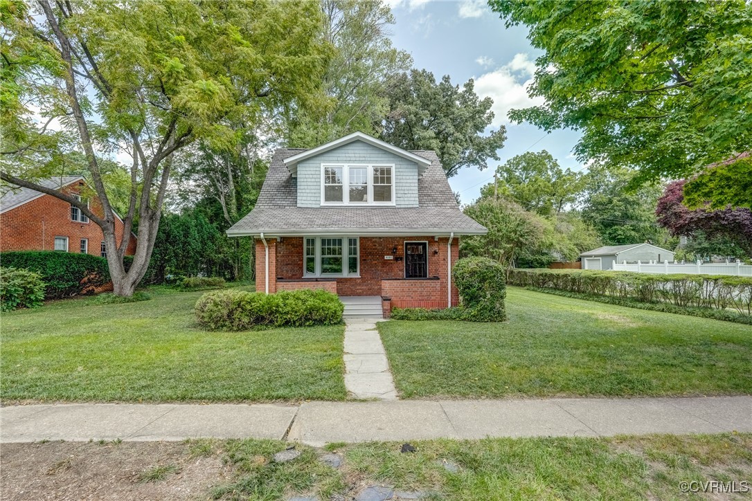 4101 Crestwood Road Richmond, VA 23227 - Photo 2 of 48 a front view of a house with a yard