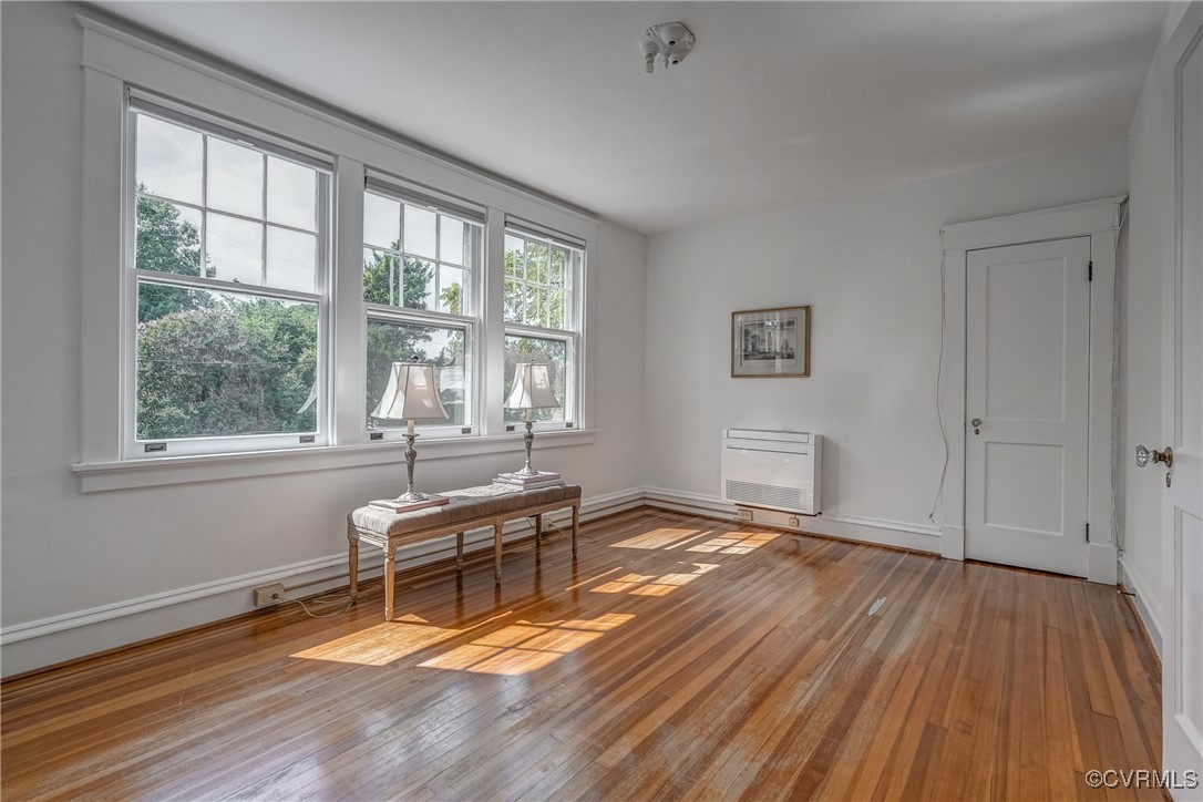 4101 Crestwood Road Richmond, VA 23227 - Photo 29 of 48 a living room with a wooden floor and a window