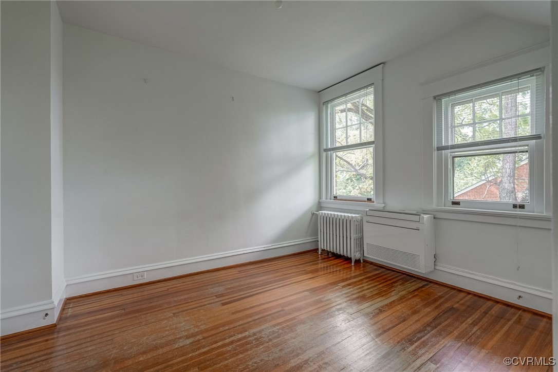 4101 Crestwood Road Richmond, VA 23227 - Photo 35 of 48 an empty room with wooden floor and windows
