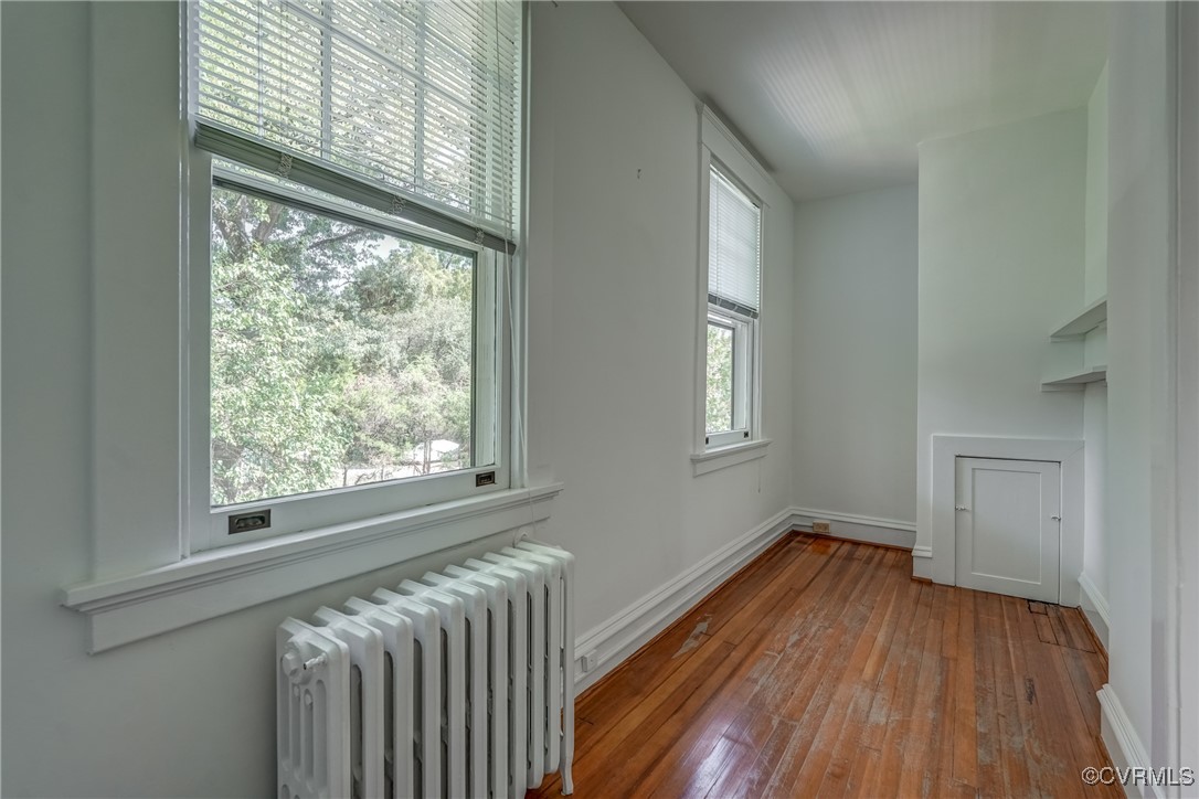 4101 Crestwood Road Richmond, VA 23227 - Photo 36 of 48 a view of an empty room with wooden floor and a window