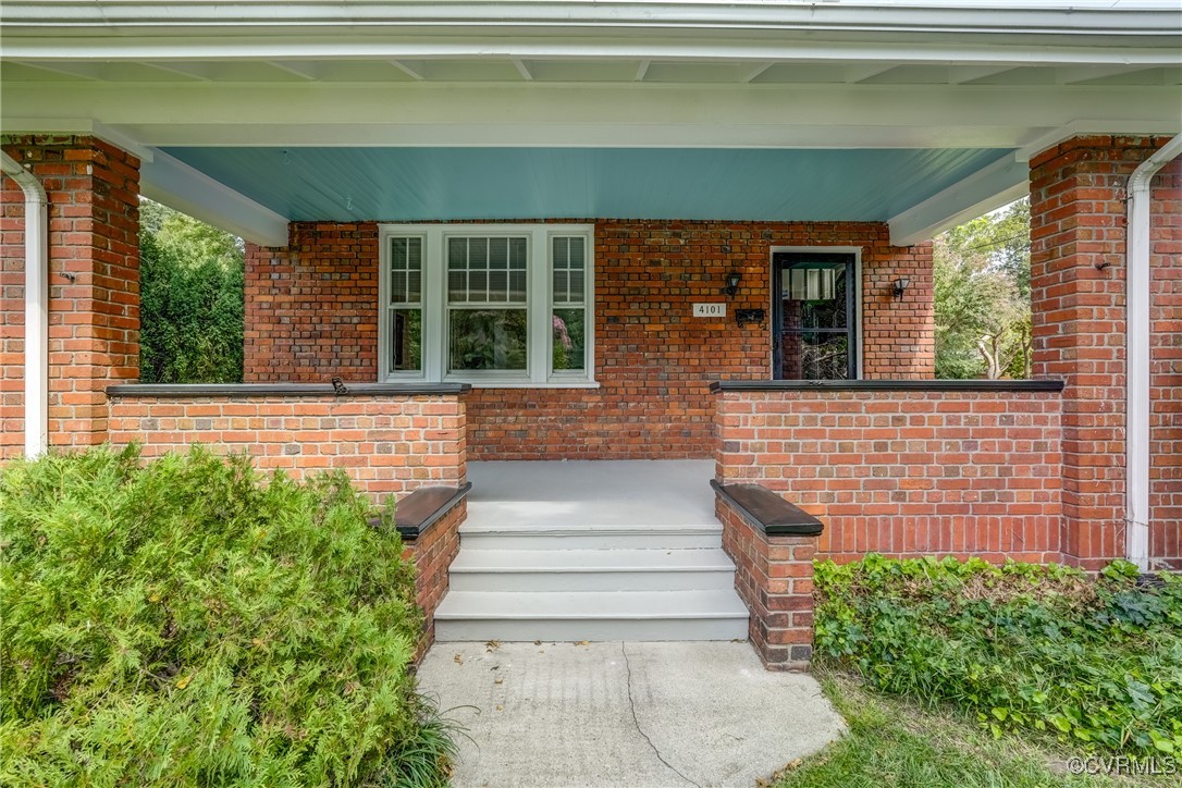 4101 Crestwood Road Richmond, VA 23227 - Photo 6 of 48 a front view of a house with a yard