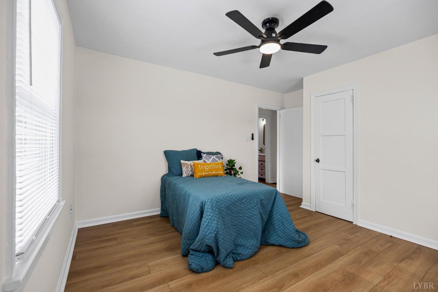 1209 Shirley Road Lynchburg, VA 24502 - Photo 14 of 27 a room with wooden floor and a ceiling fan