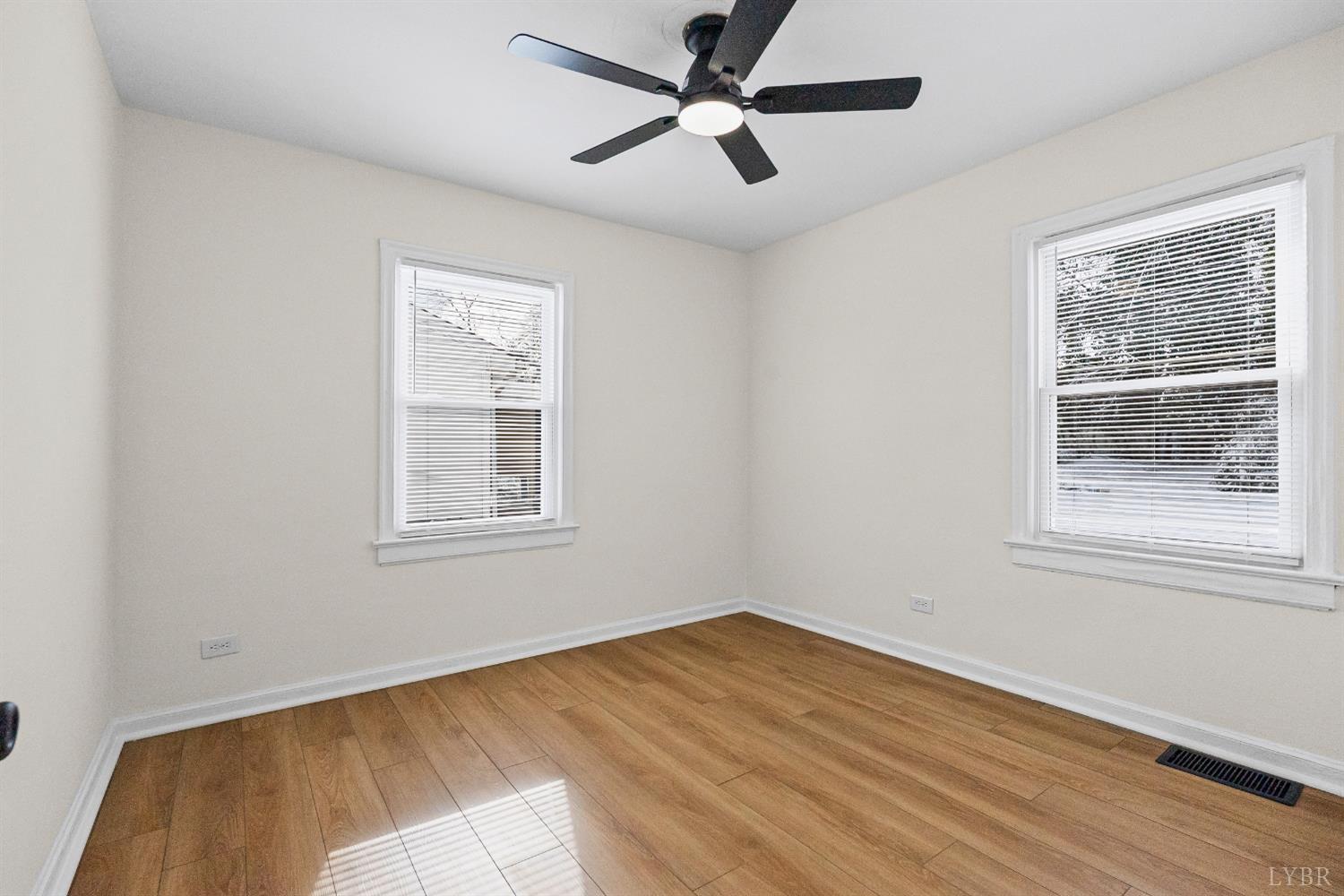 1209 Shirley Road Lynchburg, VA 24502 - Photo 18 of 27 a view of empty room with wooden floor and fan