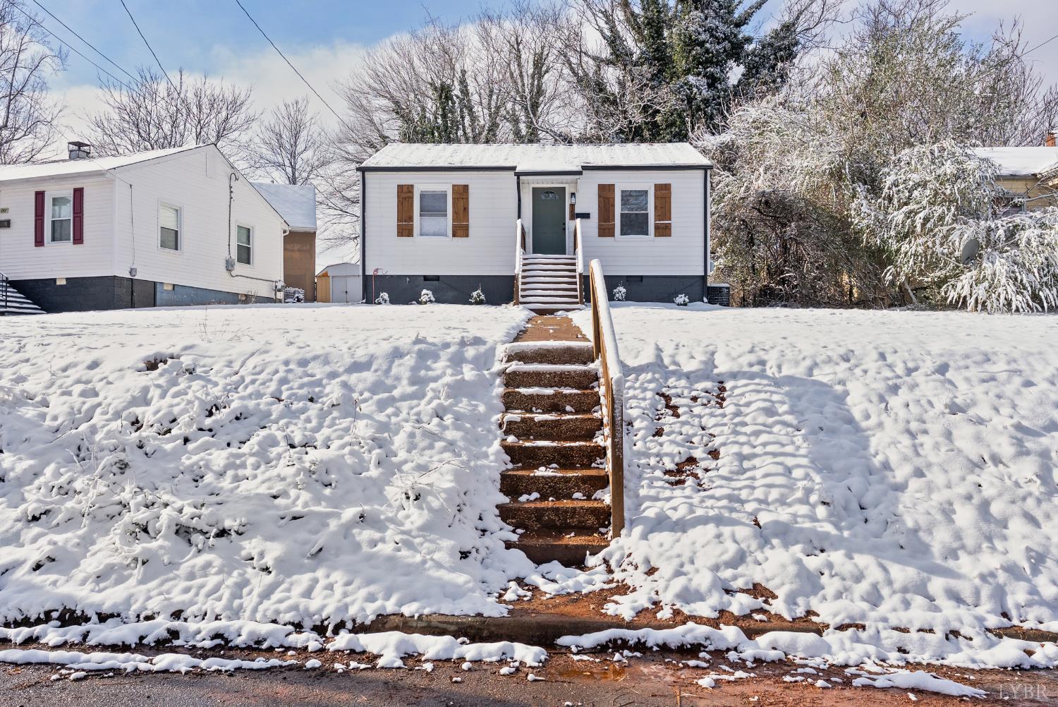 1209 Shirley Road Lynchburg, VA 24502 - Photo 2 of 27 a front view of a house with a yard