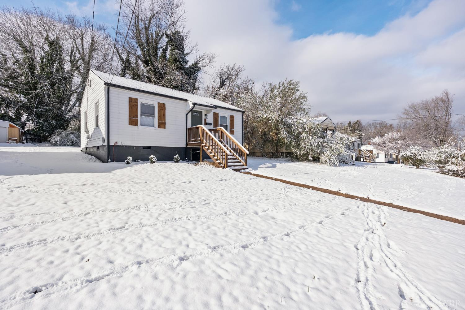 1209 Shirley Road Lynchburg, VA 24502 - Photo 23 of 27 a view of house with snow on the road