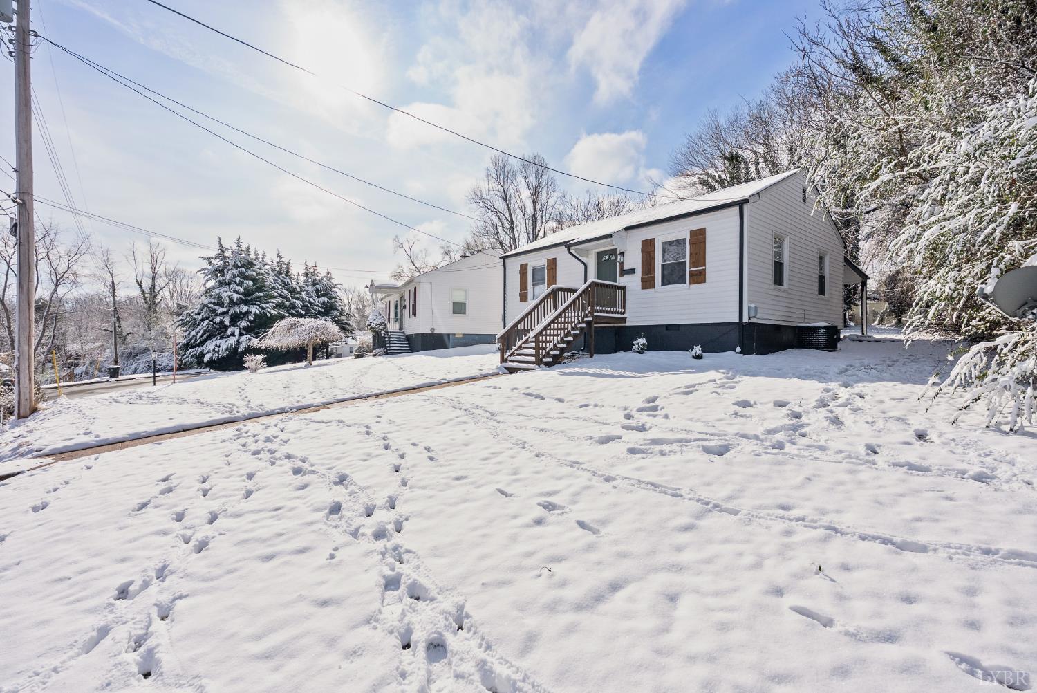 1209 Shirley Road Lynchburg, VA 24502 - Photo 24 of 27 a view of a house with a yard covered in snow