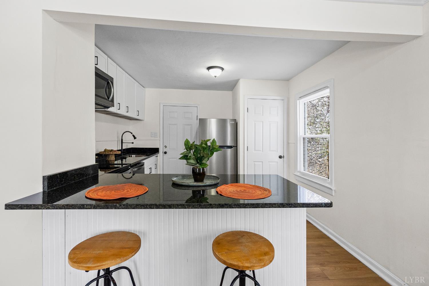 1209 Shirley Road Lynchburg, VA 24502 - Photo 8 of 27 a table room with stainless steel appliances a dining table and chairs