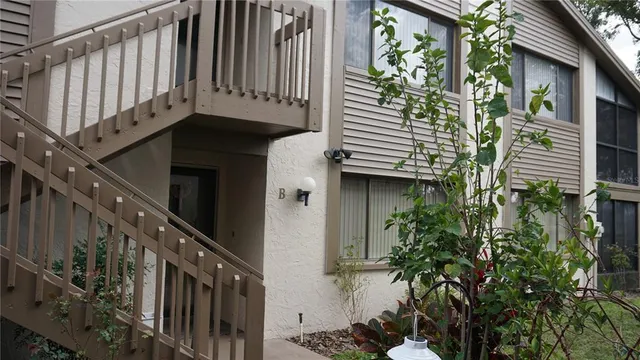 a view of a house with balcony and plants