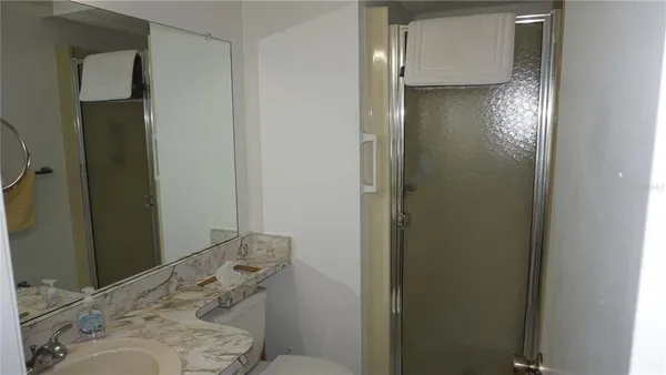a bathroom with a sink and shower