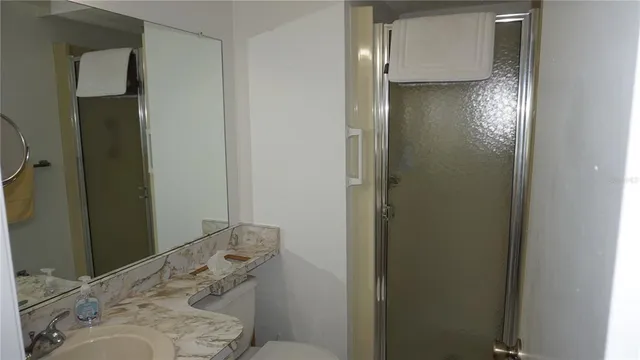 a bathroom with a sink and shower