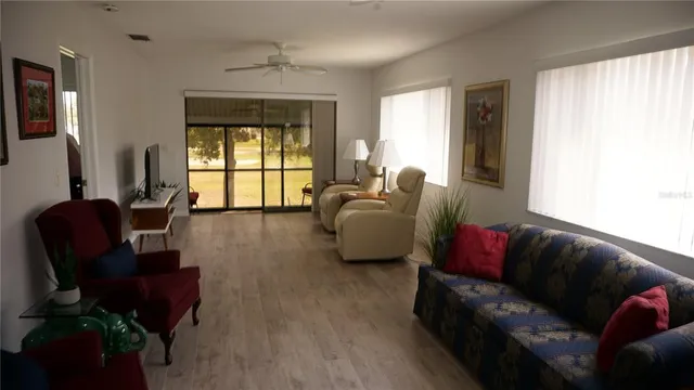 a living room with furniture and a window