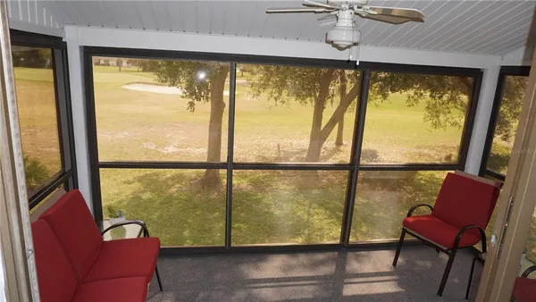 a view of a living room with a large window