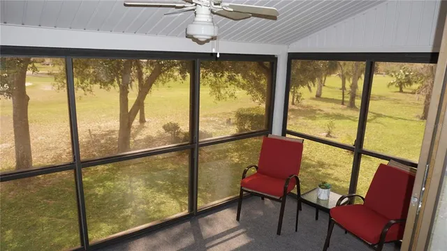 a view of a chair and table in the room