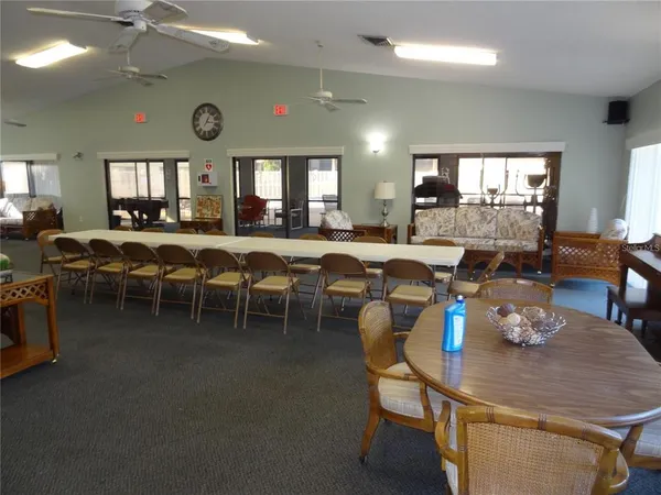 a view of a dining room with furniture and window