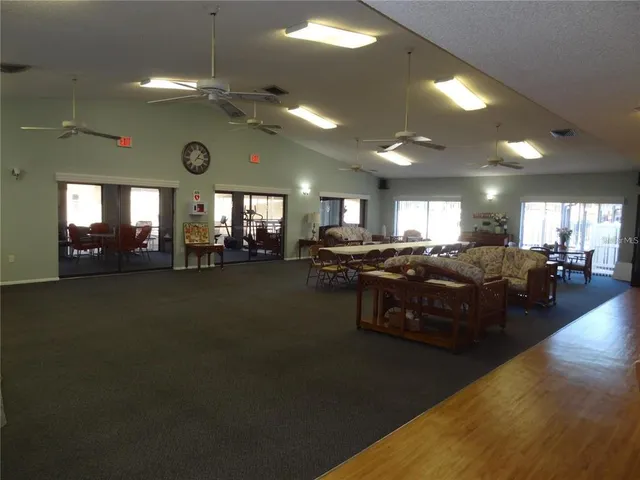 a lobby with furniture and a potted plant