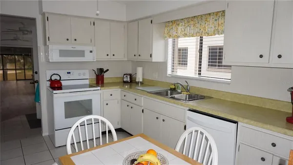 a kitchen that has a cabinets and a stove