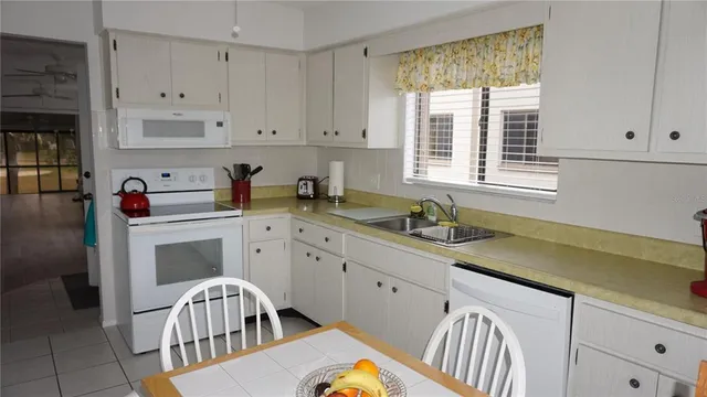 a kitchen that has a cabinets and a stove