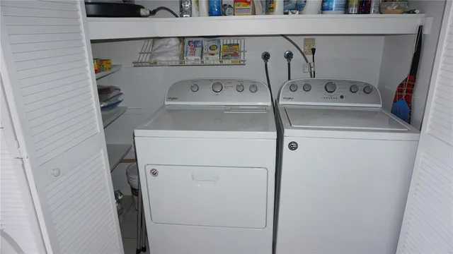 a utility room with dryer and washer