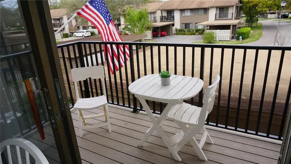 a view of balcony and wooden floor