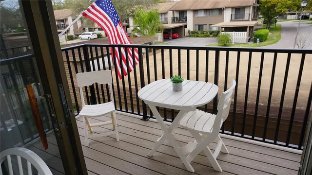 a view of balcony and wooden floor